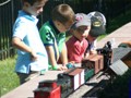 Kids keep a close eye on passing trains.